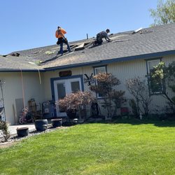 All Weather Roofing of Yakima - Workers removing damaged roof.