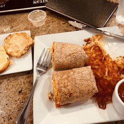 Watusi Cafe - Breakfast burrito with hashbrowns and biscuit with honey butter.