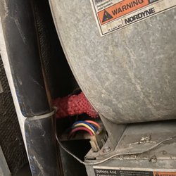 Rosewood Estates - A broken air conditioner unit being kept together by my personal dog' toy wedged between the wall and the fan   Better look