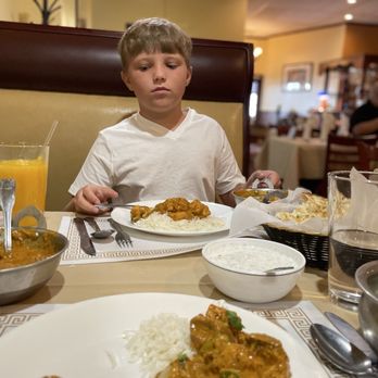 Taste Of India - The dish closer is a lamb Marsala. The further is chicken curry with rice. The Raita and garlic naan was awesome too. - Indian Near Me - Buffalo, New York Taste Of India - The dish closer is a lamb Marsala. The further is chicken curry with rice. The Raita and garlic naan was awesome too. - Indian Near Me - Buffalo, New York