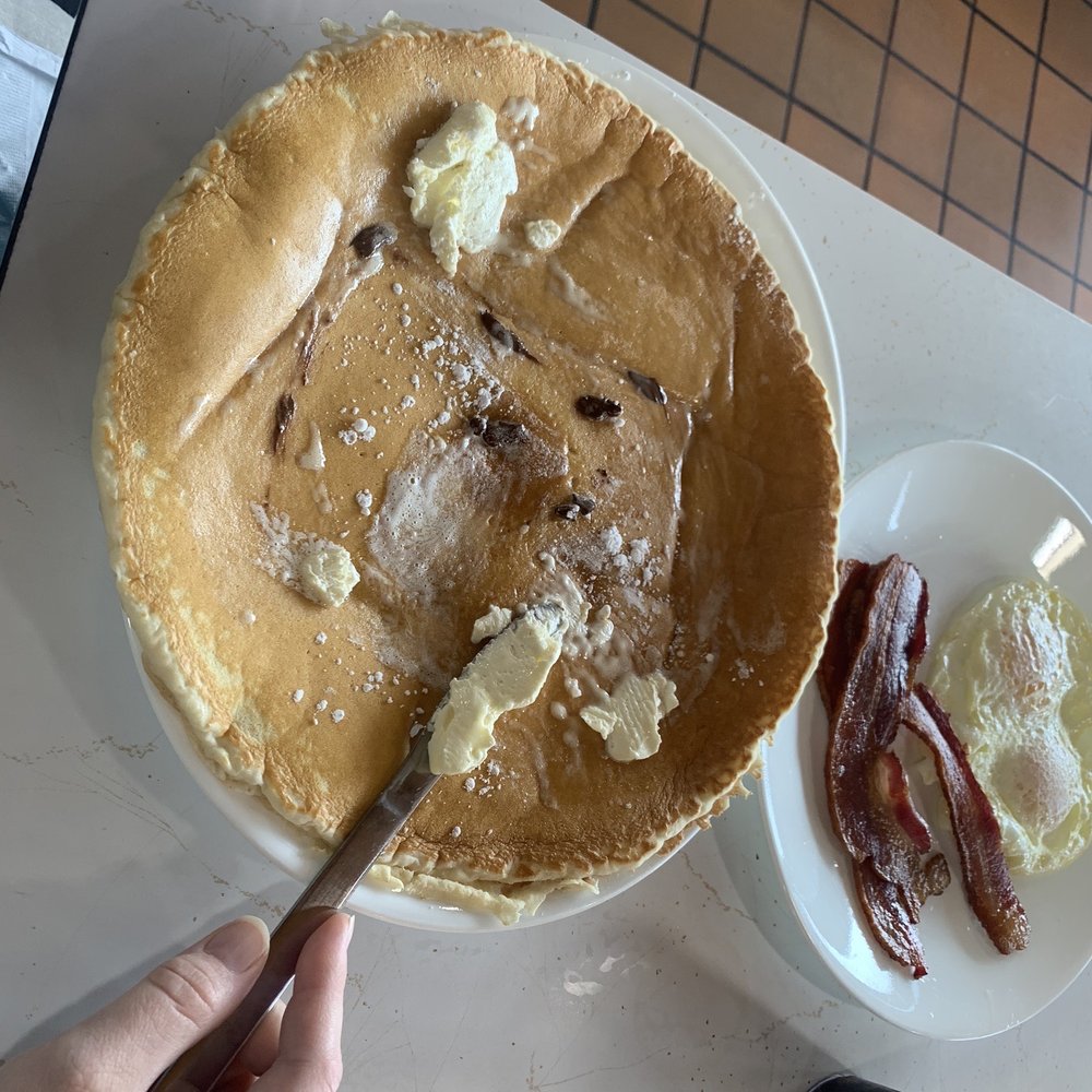 Little Oscar's Restaurant - Gigantic pancake - alongside eggs and bacon - American Near Me - Hampton, Minnesota Little Oscar's Restaurant - Gigantic pancake - alongside eggs and bacon - American Near Me - Hampton, Minnesota