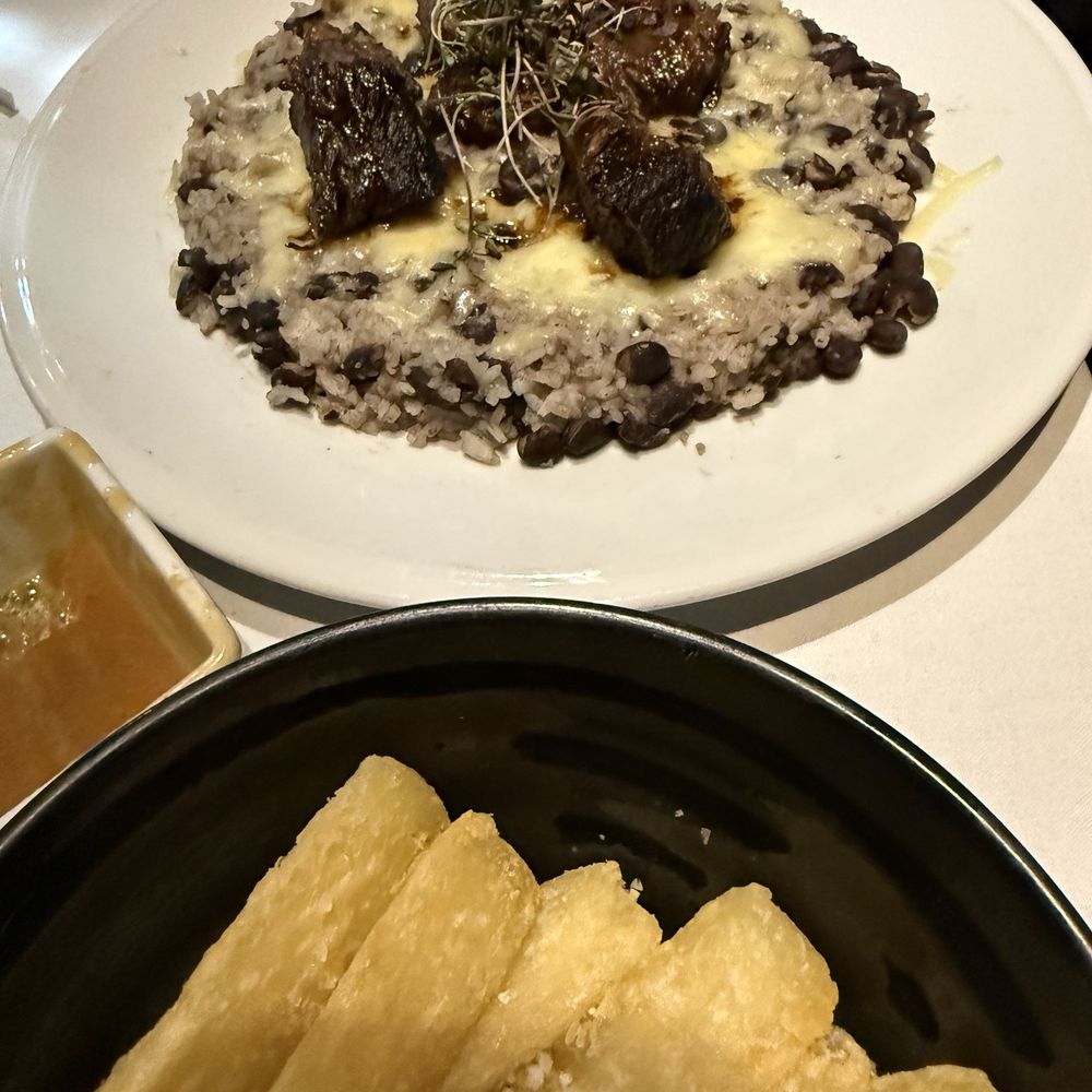 Kaiyo Grill & Sushi - Short rib on bed of white rice and black beans w a side of yuca - Sushi Bars Near Me - Islamorada, Florida Kaiyo Grill & Sushi - Short rib on bed of white rice and black beans w a side of yuca - Sushi Bars Near Me - Islamorada, Florida