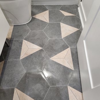 Albert Construction Renovations - a bathroom floor with a star pattern - Cabinetry Near Me Albert Construction Renovations - a bathroom floor with a star pattern - Cabinetry Near Me