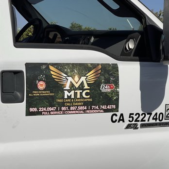 MTC Tree Care - Truck signage stating, "All work guaranteed." - Tree Services Near Me