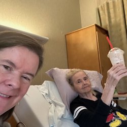ProMedica Skilled Nursing and Rehabilitation - Sterling Heights - Enjoying time with mom as she reclines in her comfy bed