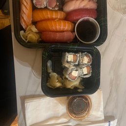 Partially eaten Sushi Dinner and Philadelphia Roll Partially eaten Sushi Dinner and Philadelphia Roll