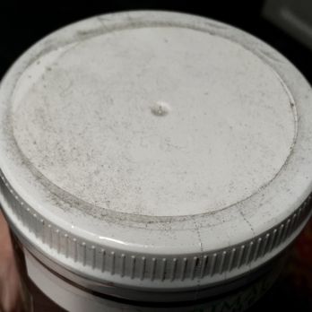 Lazy Acres Market - Primal Kitchen collagen canister lid. Filthy products located on shelves across from store entry. Store needs to step up cleaning efforts. - Grocery Near Me - Santa Barbara, California