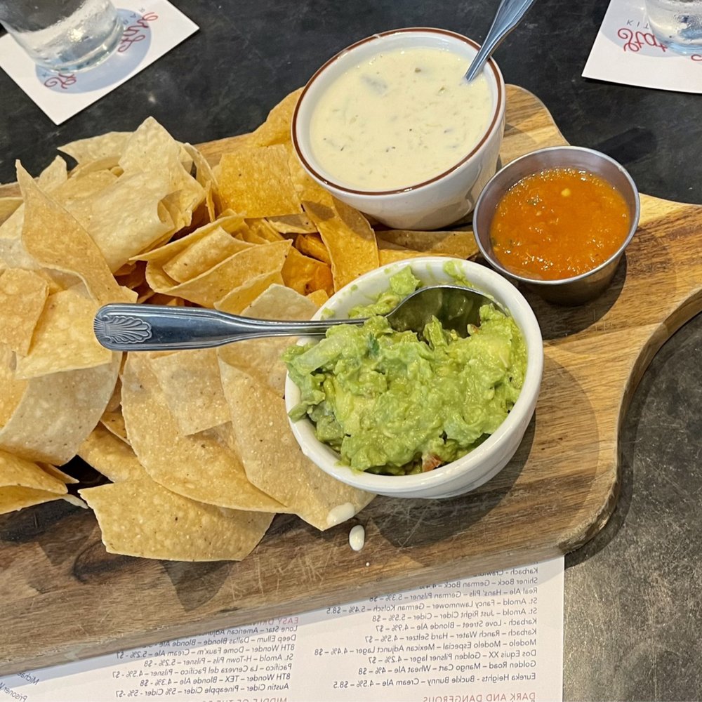 State Fare Kitchen & Bar - Queso Blanco with Green Chiles Dinner and Chunky Guacamole Norteno Style Dinner - New American Near Me - Houston, Texas State Fare Kitchen & Bar - Queso Blanco with Green Chiles Dinner and Chunky Guacamole Norteno Style Dinner - New American Near Me - Houston, Texas