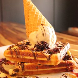 Duo Bar & Restaurant - Our sweet brekky waffles served with berry compote, ice cream and drizzled with chocolate sauce
