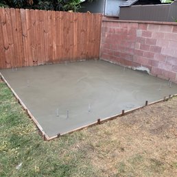 Finished slab with anchors for deck/shed build.
