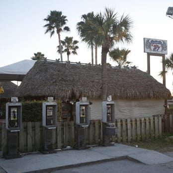 Cafe 27 - Old payphones and Cafe 27's straw roof give it that dive bar feel. - Tiki Bars Near Me - Southwest Ranches, Florida