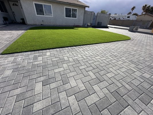 Pavers - Pavers are the perfect solution for enhancing your home's outdoor space. Available in a variety of styles, colors, and textures. These pavers are durable and not only elevate curb appeal but also provide a long-lasting surface for driveways, patios and walkways. Transform your home with our expertly installed pavers, creating beautiful and functional outdoor areas that you will enjoy for years to come. Pavers - Pavers are the perfect solution for enhancing your home's outdoor space. Available in a variety of styles, colors, and textures. These pavers are durable and not only elevate curb appeal but also provide a long-lasting surface for driveways, patios and walkways. Transform your home with our expertly installed pavers, creating beautiful and functional outdoor areas that you will enjoy for years to come.