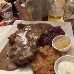 Pork schnitzel with cabbage and potato pancake Pork schnitzel with cabbage and potato pancake