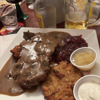 Schnitzel Kitchen - Pork schnitzel with cabbage and potato pancake - German Near Me - Sarasota, Florida Schnitzel Kitchen - Pork schnitzel with cabbage and potato pancake - German Near Me - Sarasota, Florida