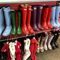 Plato's Closet-Minnetonka - Rain boots section filled w/ Hunters