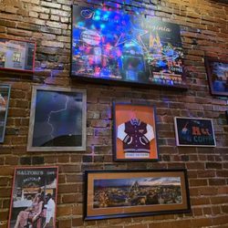 Ernie's - The brick wall is filled.with historic and significant photos.