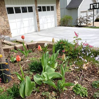 Better Concrete Construction - tulips and other flowers in front of a house - General Contractors Near Me - Olathe, Kansas