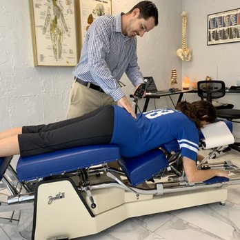 Integrated Chiropractic - Instrument adjusting a pregnant patient. - Chiropractors Near Me - Sarasota, Florida Integrated Chiropractic - Instrument adjusting a pregnant patient. - Chiropractors Near Me - Sarasota, Florida