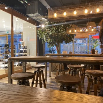 Espresso House - Seating area near the front where we perched on high counters with an assortment of stools. - Cafes Near Me - Göteborg, O