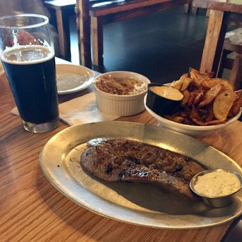 Territorial Brewing Company - Blueberry brat special with olive mayo, sauerkraut and TBC aioli german chips with an Easy Giese porter. - German Near Me - Springfield, Michigan