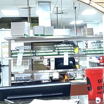 Marco's Pizza - Notice all pizza orders etc waiting to be picked up and someone is actually standing behind them.  Trying to hide. - Pizza Near Me - Lehigh Acres, Florida