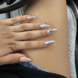 Full set acrylic fill. chrome powder, charm, blue sparkly polish w building gel for the lifted design. Full set acrylic fill. chrome powder, charm, blue sparkly polish w building gel for the lifted design.