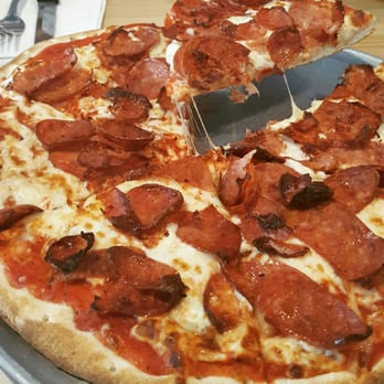 Pendeli’s Pizza - a slice being taken out of a pepperoni pizza - Pizza Near Me - Laval, Quebec Pendeli’s Pizza - a slice being taken out of a pepperoni pizza - Pizza Near Me - Laval, Quebec
