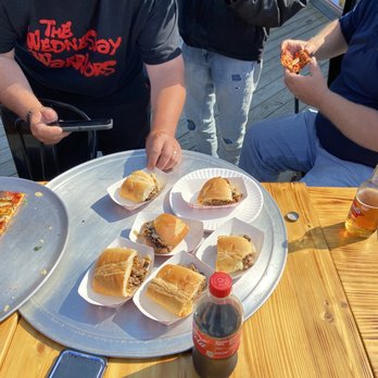 Shore Slice Pizza & Grill - a man eating a sandwich - Pizza Near Me - Seaside Heights, New Jersey