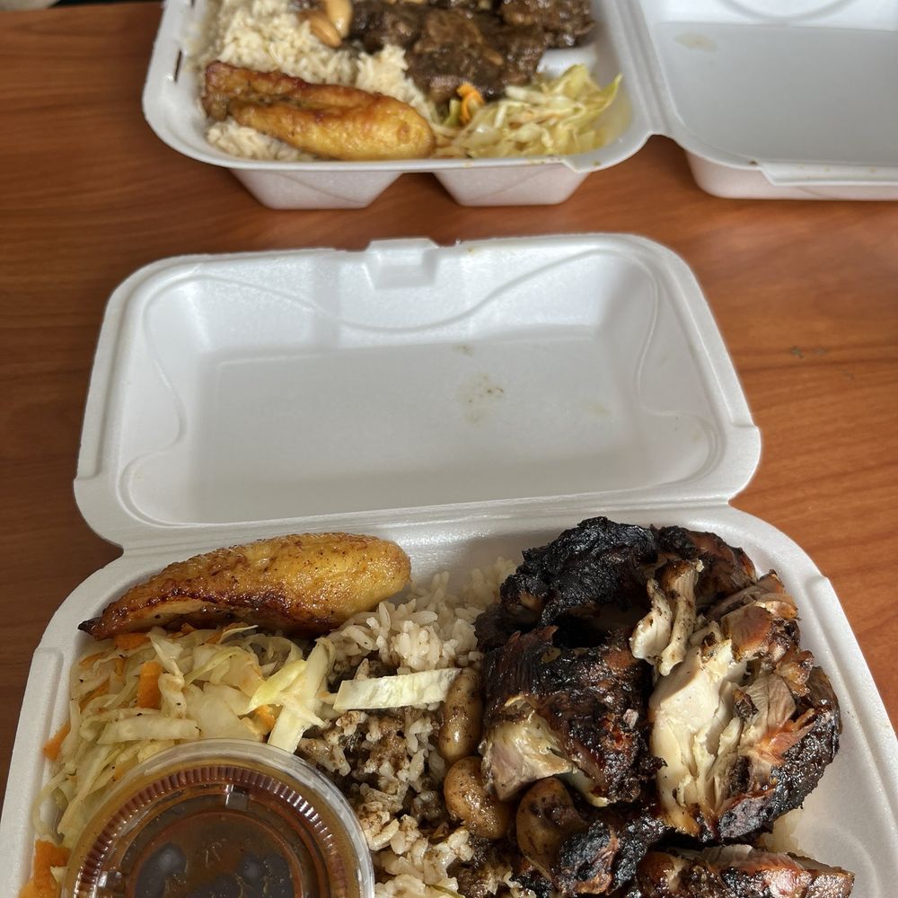 Strawberry Restaurant - Jerk Chicken (bottom) Oxtail(top) - Caribbean Near Me - Palm Bay, Florida