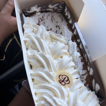 Porto's Bakery & Cafe - Tres Leches Cake Loaf (it got messed up because we dropped the bag) - Bakeries Near Me - Burbank, California Porto's Bakery & Cafe - Tres Leches Cake Loaf (it got messed up because we dropped the bag) - Bakeries Near Me - Burbank, California