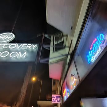 Recovery Room - a neon sign on the side of a building - Sports Bars Near Me - San Francisco, California