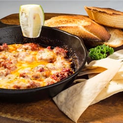 Café Cubana - Queso Fundido
A mixture of Cheese, Chorizo & Shrimp