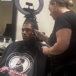 Gentlemen's Cut & Grooming - Putting the finishing touches on one of our clients.