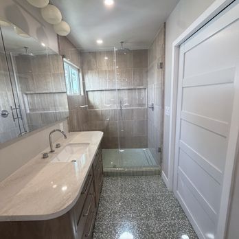 DB Construction - Remodeled primary bathroom with custom tile and custom white oak vanity. - General Contractors Near Me - Los Angeles, California