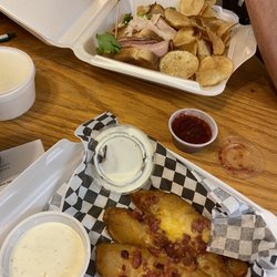 Dakotas Restaurant - Club sandwich with in-house made chips and potato spuds!