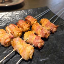 Jin Gang Shan BBQ - Grilled bacon wrapped enoki mushrooms $9.98