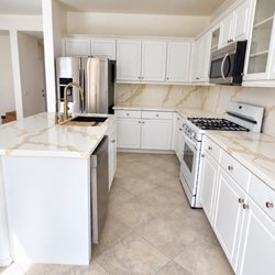 Simplified Home Remodeling - Calcatta gold quartz kitchen countertop and backsplash with sink and faucet installation