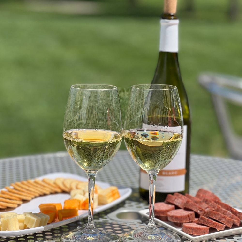 Enjoying Seyval Blanc with cheese and sausage. Enjoying Seyval Blanc with cheese and sausage.