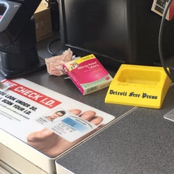 7-Eleven - Crumpled receipt and discarded medicine box at check out counter. Just a small sample of all the garbage strewn about this store.