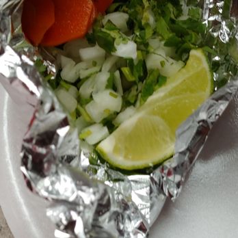 Taqueria La Quetzalteca - a taco wrapped in aluminum foil - Food Stands Near Me - Bluffton, South Carolina Taqueria La Quetzalteca - a taco wrapped in aluminum foil - Food Stands Near Me - Bluffton, South Carolina
