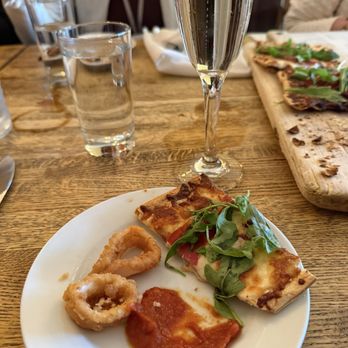 Treva Restaurant & Bar - Calamari, fig prosciutto arugula Artisanal Flatbread - Italian Near Me - West Hartford, Connecticut