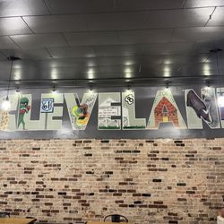 Zoe Coffee - Cool Cleveland sign inside seating area