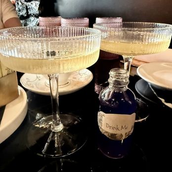 Story - Champagne with blue "Drink Me" syrup. - New American Near Me - Anaheim, California Story - Champagne with blue "Drink Me" syrup. - New American Near Me - Anaheim, California
