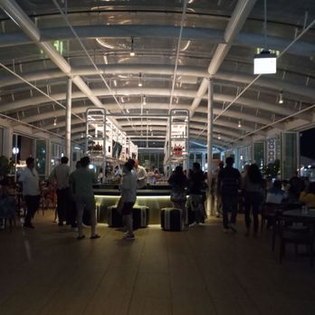 Offshore Rooftop - Entrance of bar in spacious airplane hanger like room. - New American Near Me - Chicago, Illinois
