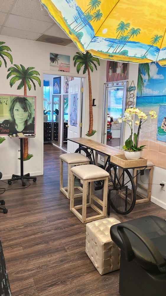 Mina's Hair salon "Happy New years. New location21150 Hawthorne bl