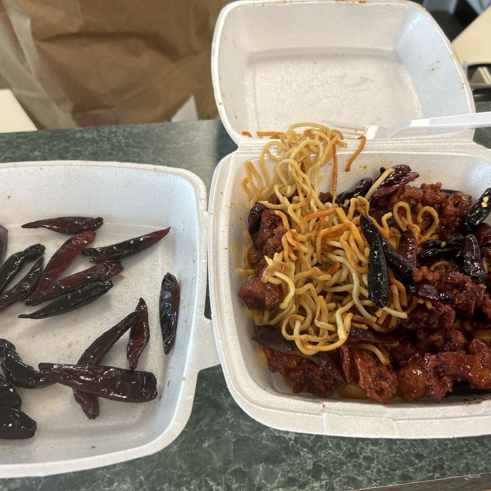 Orange chicken over noodles with burnt chilies!