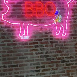A pink neon pig