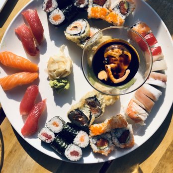 Japango - Spicy tuna, tuna nigiri, salmon nigiri, rainbow roll, tuna roll, and nanni that comes with the dipping sauce pictured. - Japanese Near Me - Boulder, Colorado