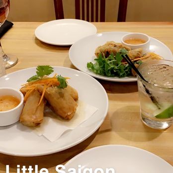 Saigon Cafe - Play in back is veggie fried spring rolls. Front plate is the pork fried spring rolls. These were delicious. - Vietnamese Near Me - Saint Louis, Missouri