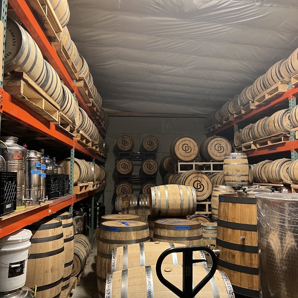 Glacier Distilling Company - barrels stacked on shelves - Beer, Wine & Spirits Near Me - Coram, Montana